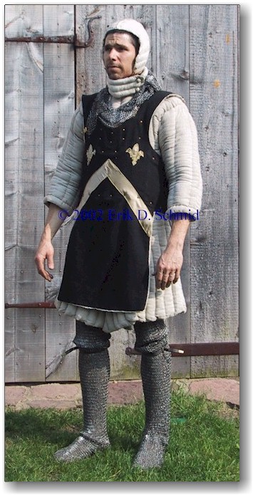 Would it be realistic or historical to wear a padded coat/gambeson with  scale armor OVER a mail hauberk like this? (I'm mostly concerned about the  realism, not so much about the history