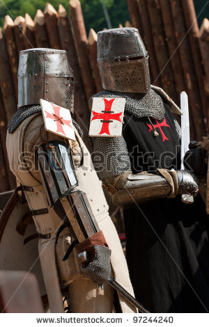 stock-photo-knight-in-armour-with-red-crosses-97244240.jpg